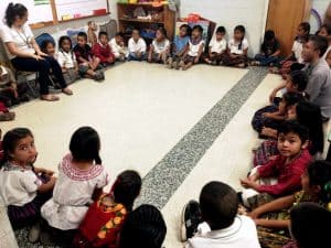 First graders sit in a circle to learn math