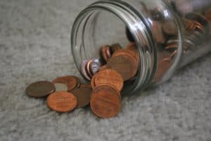 jar with pennies spilling out