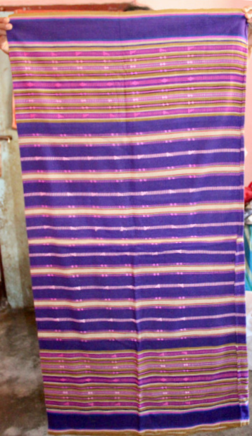 Handwoven purple textile with horizontal pink, green, yellow, and white stripes and intricate traditional geometric patterns