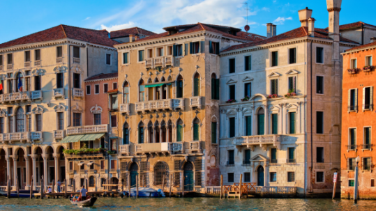 Historic Venetian palaces with ornate Gothic and Renaissance façades overlooking the Grand Canal in Venice, Italy