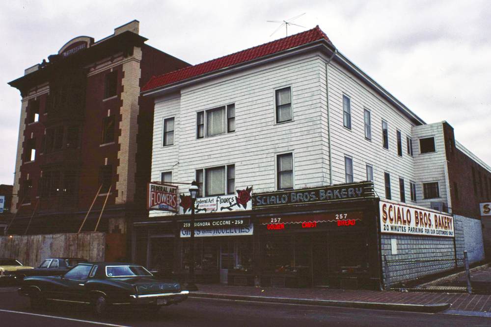 Historic street view of Scialo Bros. Bakery in Providence, Rhode Island, featuring its storefront, vintage signage, and parked cars